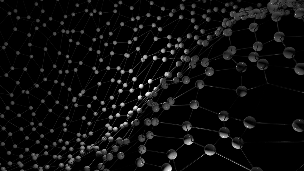 Abstract 3D molecular structure composed of interconnected spheres and lines, representing a crystalline or atomic lattice on a black background.