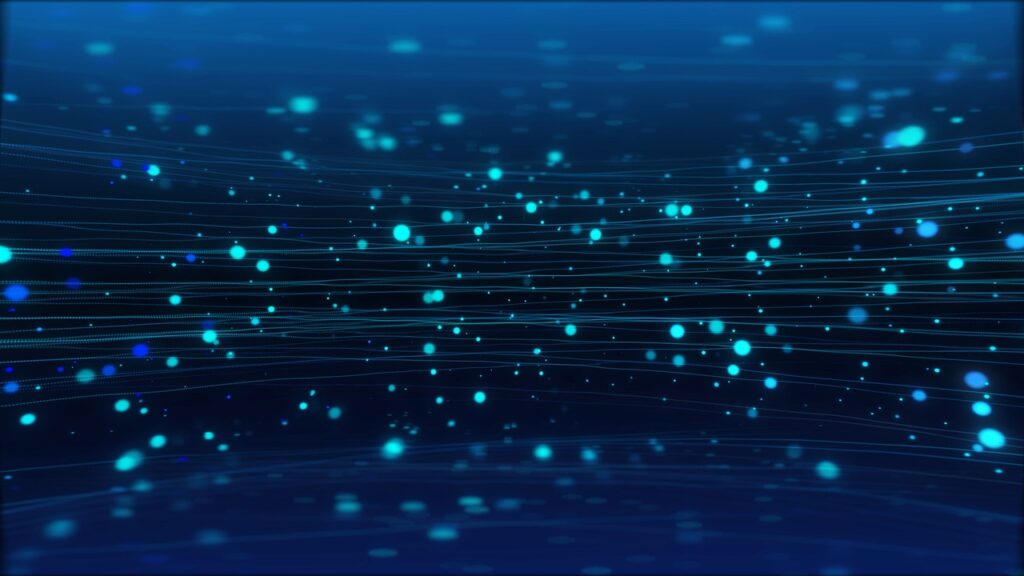 Abstract digital illustration of glowing blue particles and flowing lines against a dark background, representing data or particle movement.