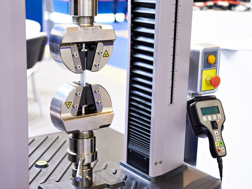 Image of a mechanical testing device to test product quality which includes Hass Testing