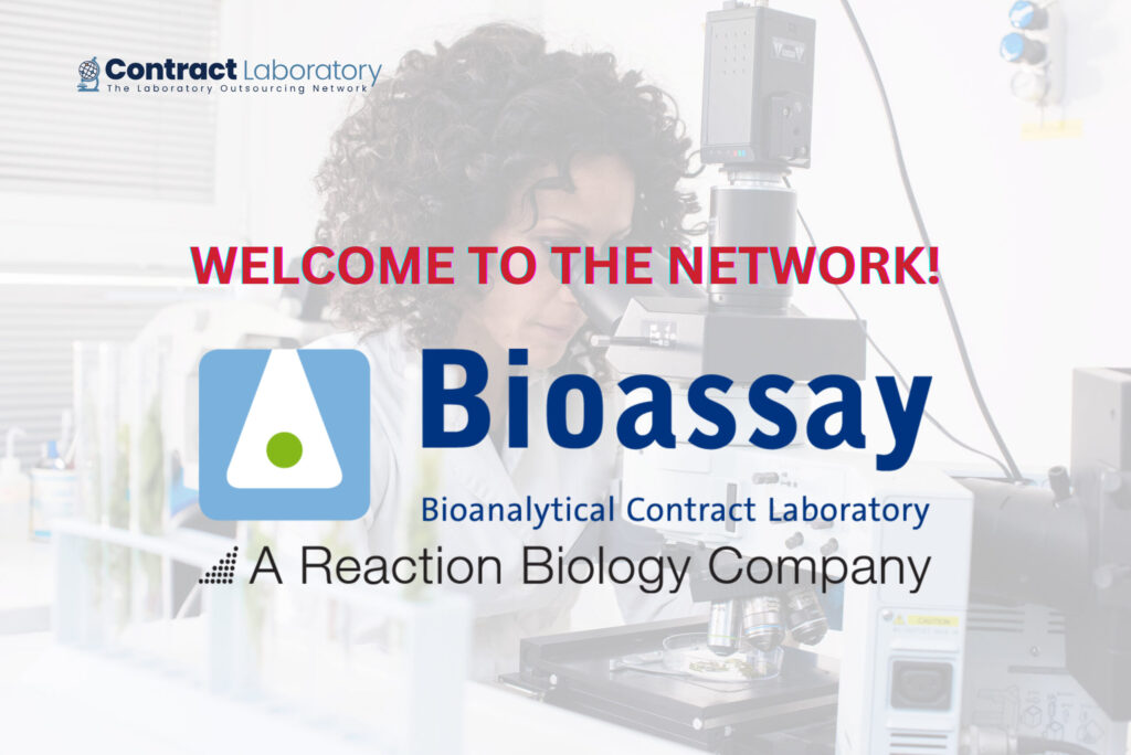 Bioassay GmbH logo on an photo of a female scientist looking into an electronic microscope.