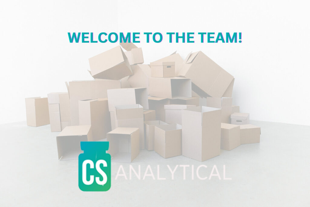 A heap of open cardboard boxes and cartons laying on the ground as "Welcome to the Team" and Cs Analytical's logo are on the foreground.