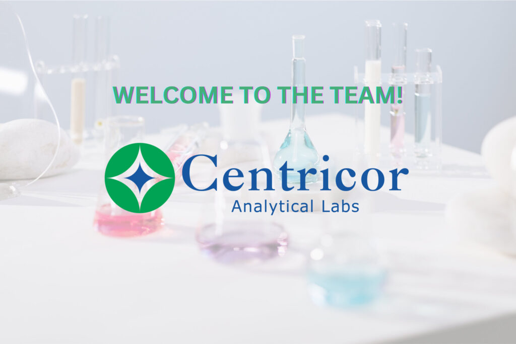Labware with different colored solutions are arranged on a white bench in lab setting as Centricor Analytical Labs logo is on the foreground.