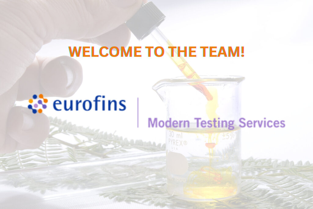 Close-up of a hand adding a colored reagent using a dropper to a half-full beaker with Eurofins MTS logo in the foreground.