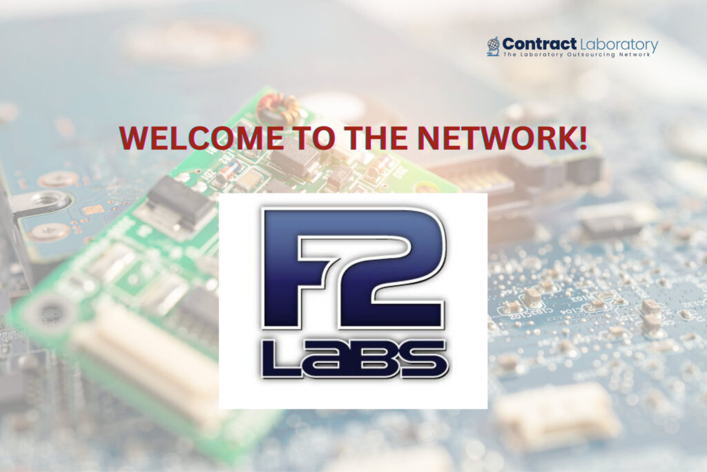 F2 Labs logo on a background of electrical microcircuits and motherboards.