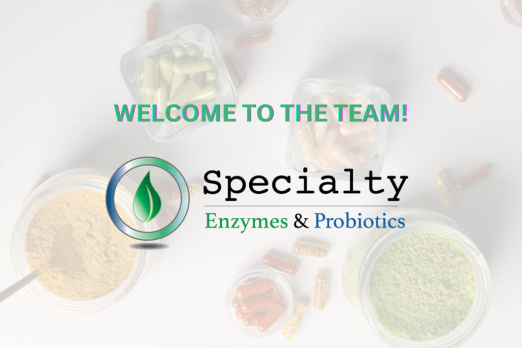 Logo of Specialty Enzymes & Probiotics on a background of capsules and colored powders.