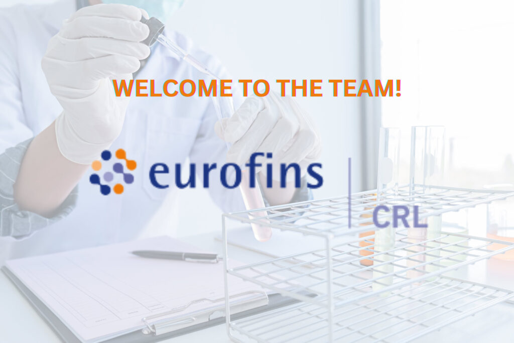 A researchers works with solutions in test tubes seated in a laboratory setting with Eurofins CRL's logo in the foreground.