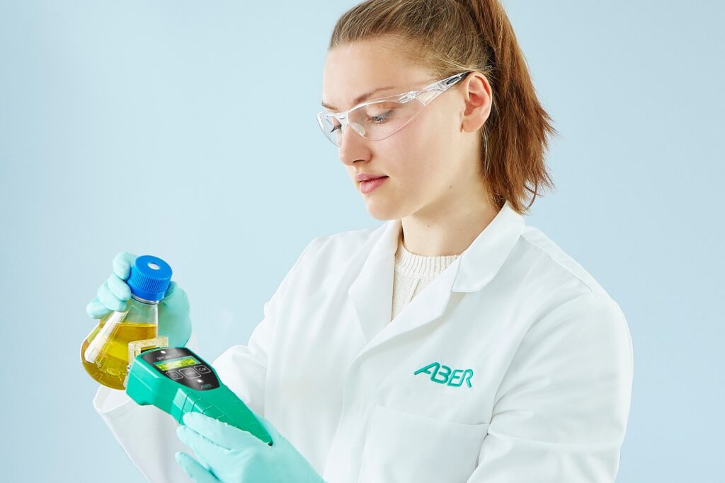 Researcher taking cell density measurements with the OPTURAPALM