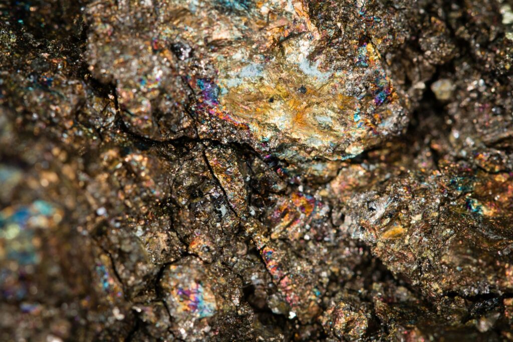 Close-up of a rock showing traces of rare earth metal ore.