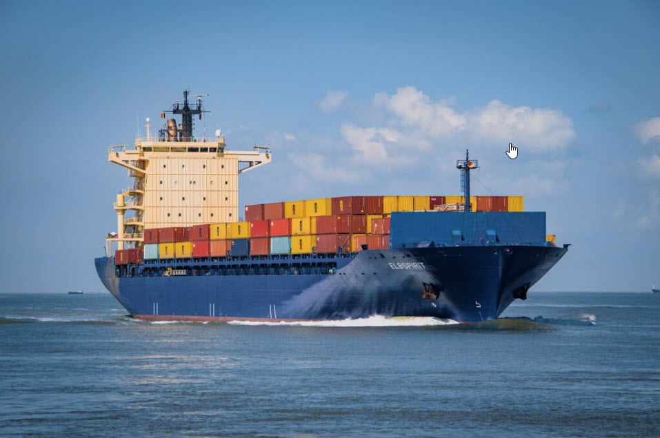 large container ship with numerous sea containers of various colors at sea