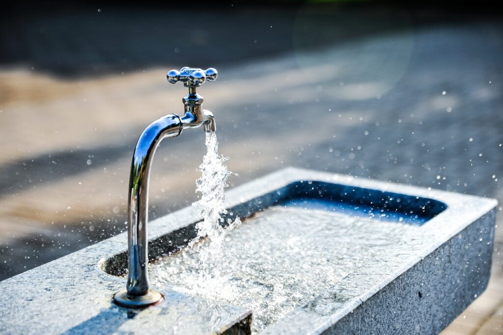 water fountain with tap and running water