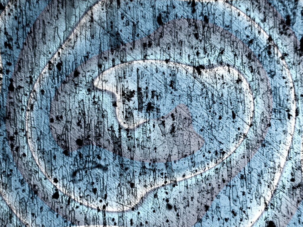 Microscopic image of metal alloy surface showing grain-like imperfections