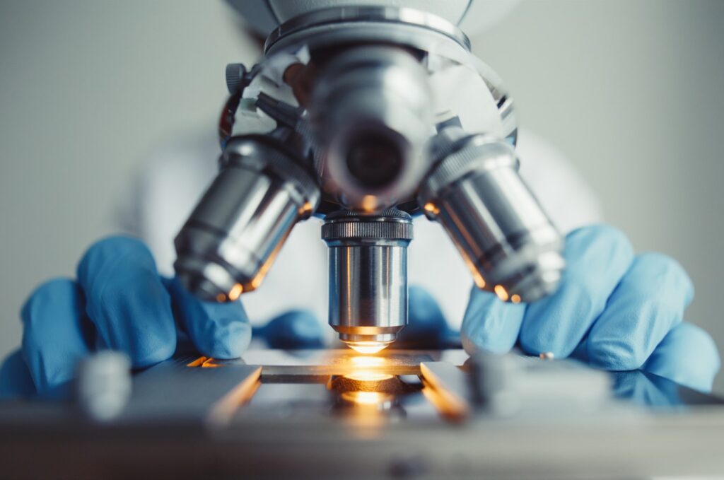image of the lenses of a microspe in profile emphasizing the importance of microbial analysis in pharmaceutical qa