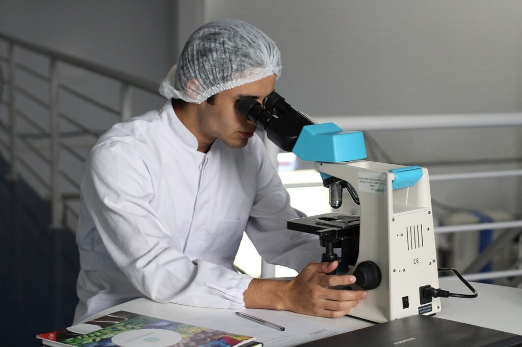 Scientist working at microscope