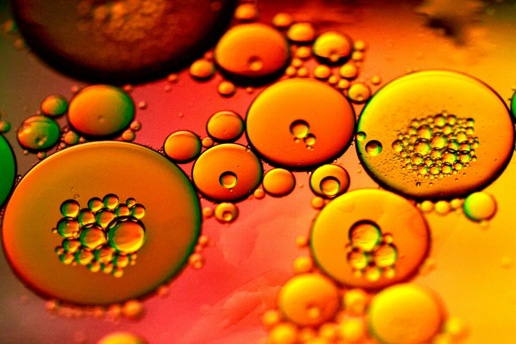 Close-up of bubbles and air pockets in a viscous liquid.